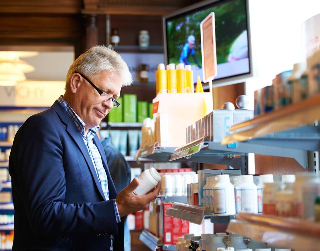 Man looking at medication